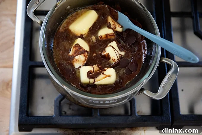 Classic Caprese Flourless Chocolate Almond Torte 5 A double boiler gently melting squares of butter and dark chocolate into a smooth, dark, and glossy mixture.