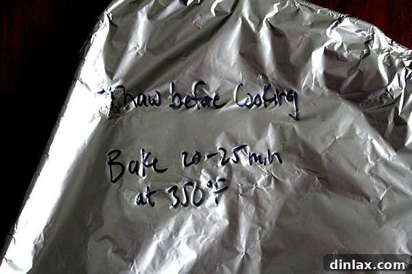 Make-Ahead Lemon & White Wine Chicken Pasta 10 A foil-covered casserole dish containing the chicken pasta bake, labeled with reheating instructions for a friend.