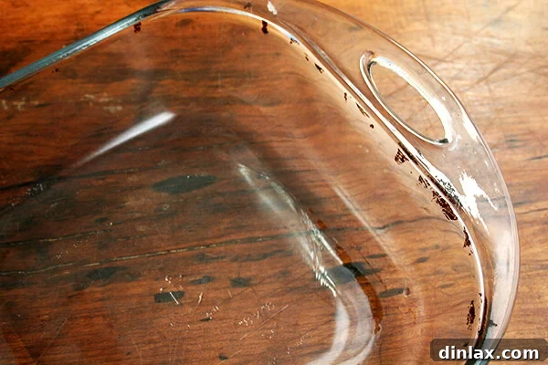 Sticky Honey-Soy Chicken 11 A shiny, clean cooking pan after being thoroughly scrubbed, ready for its next use.