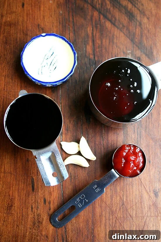 Sticky Honey-Soy Chicken 3 A collection of sauce ingredients for honey-soy oven-baked chicken drumsticks, including honey, soy sauce, ketchup, garlic, and oil.