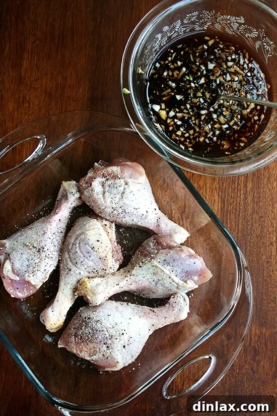 Sticky Honey-Soy Chicken 4 Chicken drumsticks lightly seasoned with salt and pepper, placed beside a bowl of the whisked honey-soy sauce mixture.