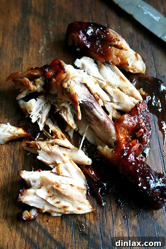 Sticky Honey-Soy Chicken 8 A close-up of a piping hot honey-soy chicken drumstick, showing the meat effortlessly falling off the bone.