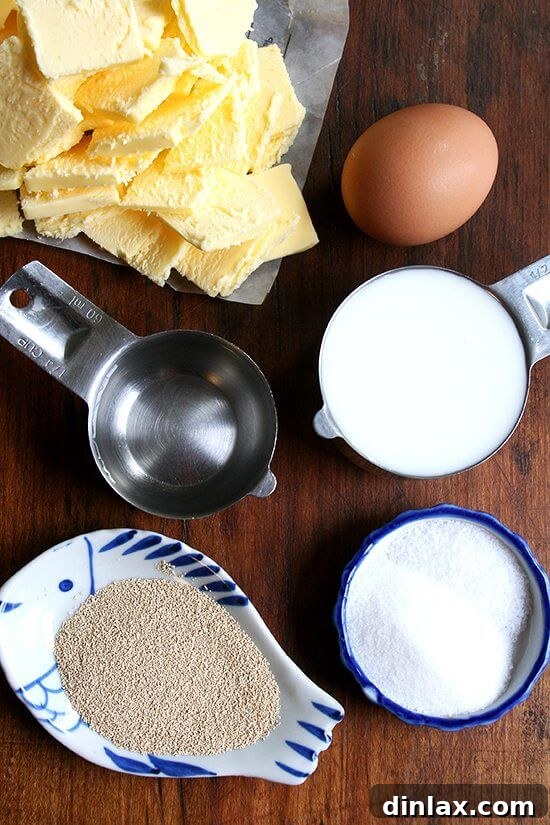 The ingredients for the food processor Danish pastry dough laid out neatly on a wooden board.