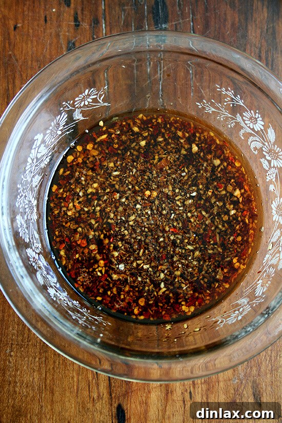 Close-up of the flavorful ginger and garlic soy dressing, perfect for coating soba noodles and marinating tofu.