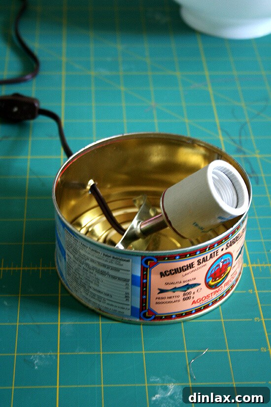 Step-by-step process of making the anchovy tin lamp, showing wiring and assembly.