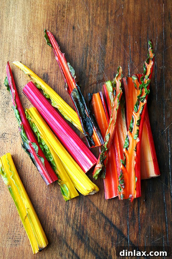 Freshly picked Swiss chard stems, separated from their leaves, ready for preparation.