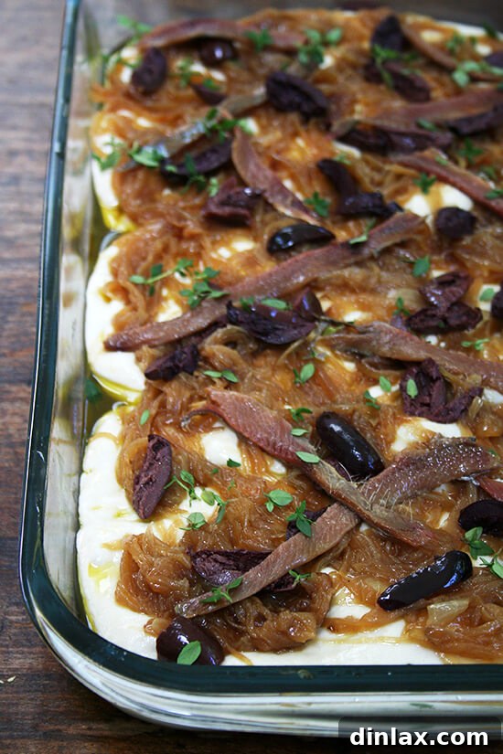 Lahey Pizza Dough Rescue: Pissaladière and Focaccia 7 Pissaladière ready for the oven, showcasing its vibrant toppings.