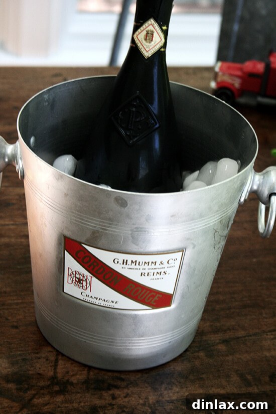 Lahey Pizza Dough Rescue: Pissaladière and Focaccia 9 A bottle of prosecco, signifying celebration and enjoyment with the meal.