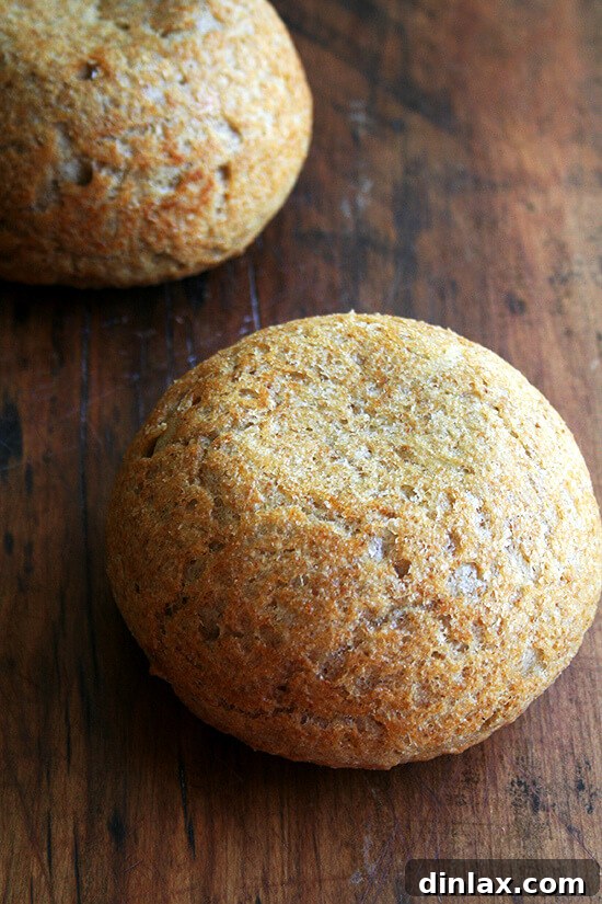 Jammy Rhubarb Ripple Ice Cream 15 Two freshly baked loaves of homemade peasant bread on a cooling rack, golden-brown and inviting.