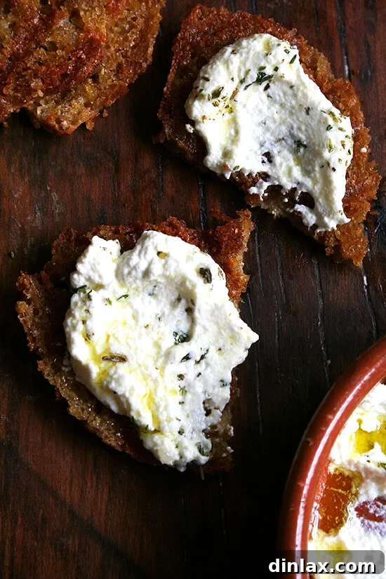 The perfect balance: cool and creamy fresh ricotta meets smoky, charred grilled bread. These small touches make a big difference. If you haven't tried them or made fresh ricotta from scratch, seize the moment! Slices of grilled bread generously topped with fluffy ricotta and fresh herbs.