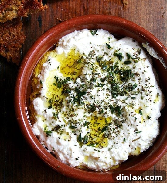 Homemade ricotta with fresh thyme, dried oregano, olive oil, and grilled bread
