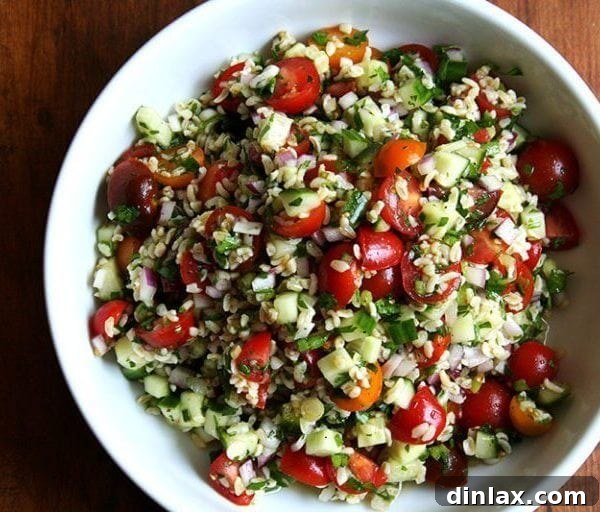 A bowl of vibrant tabbouleh salad with fresh herbs and vegetables.