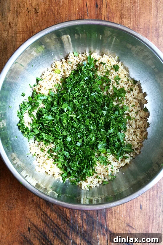 A generous pile of freshly chopped parsley, a key ingredient for authentic tabbouleh.