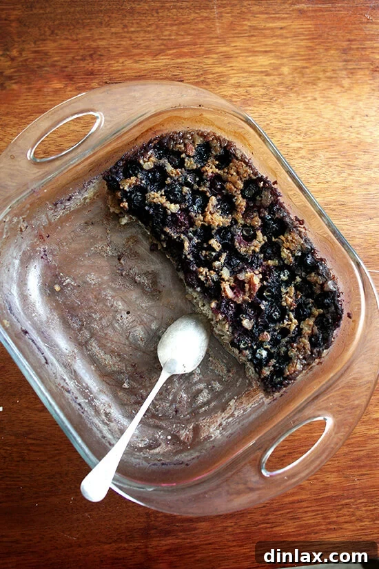 Wholesome Baked Steel Cut Oats 8 A half-eaten pan of baked steel cut oatmeal, showing several servings already enjoyed.