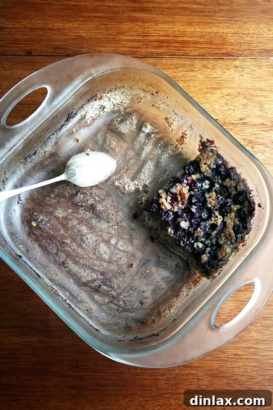 Wholesome Baked Steel Cut Oats 9 A three-quarters eaten pan of baked steel cut oatmeal, with only a few servings remaining.