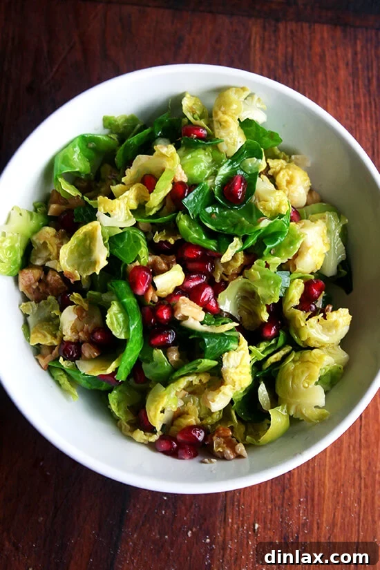 This stunning Brussels sprout salad with pomegranate, walnuts, and jalapeño is a vibrant and fresh addition to any holiday meal, beautifully balancing richer dishes.