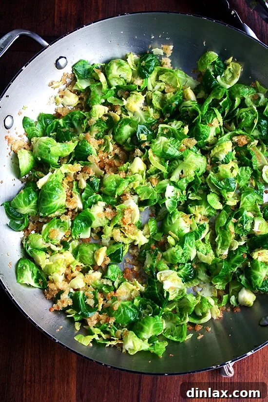 Sautéed Brussels sprout leaves with toasted bread crumbs, a simple yet elegant side dish.