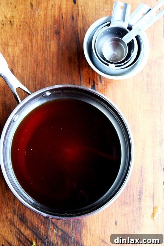 Teriyaki sauce in a saucepan, ready to be simmered for chicken breast preparation.