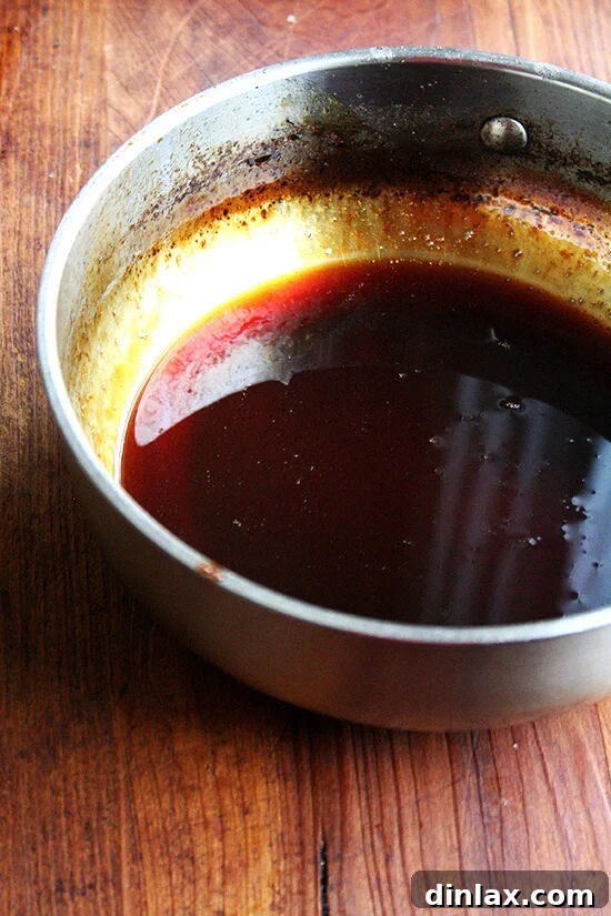 Reduced teriyaki sauce, visibly thick and syrupy, ready for serving.