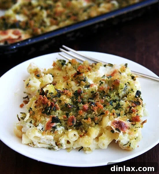 A single serving of golden, crispy sheet pan mac n' cheese on a plate, ready to eat.