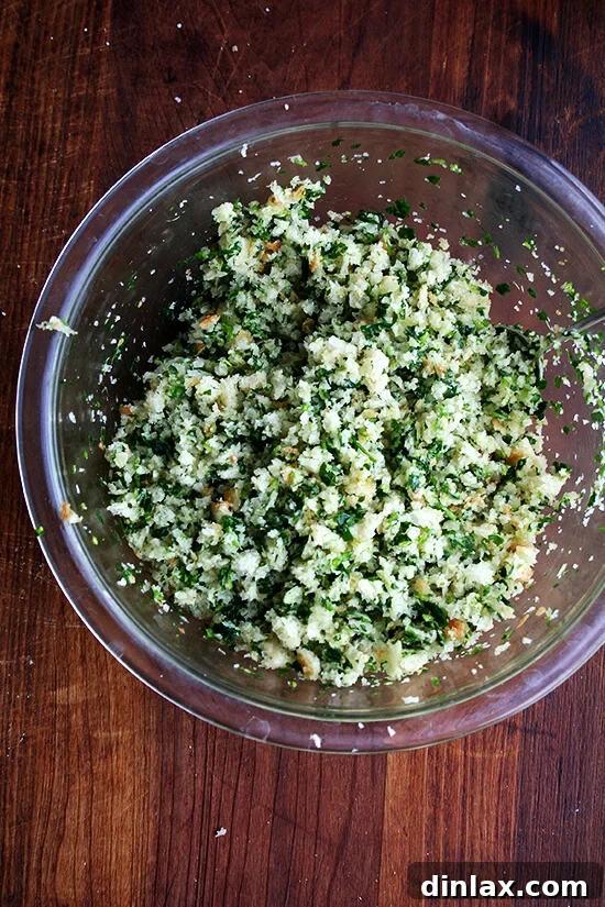 Golden Crispy Macaroni Cheese Bake 4 Detailed shot of finely chopped herbs and garlic mixed with bread crumbs, ready for topping