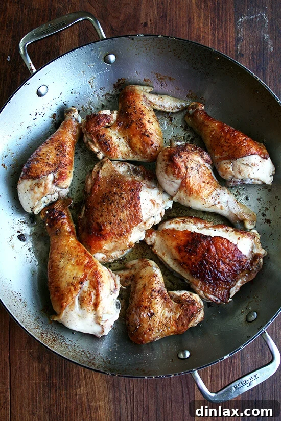 The Iconic Canal House Chicken and Rice 4 Browning chicken in a wide pot with melted butter, a vital first step to build deep flavor for this comforting one-pot meal.