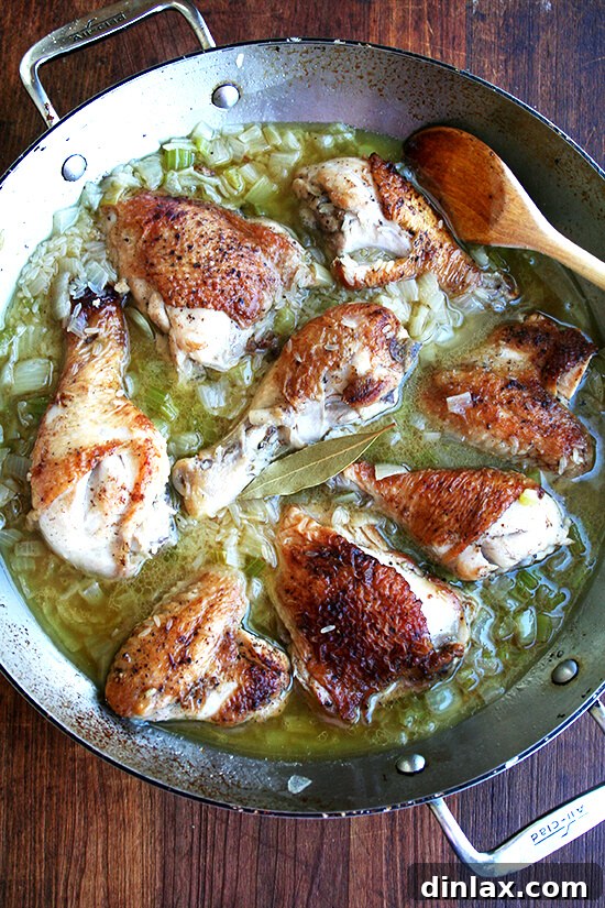 The Iconic Canal House Chicken and Rice 7 Water being poured into the pot with chicken and rice, which will transform into a rich broth as the ingredients simmer together.