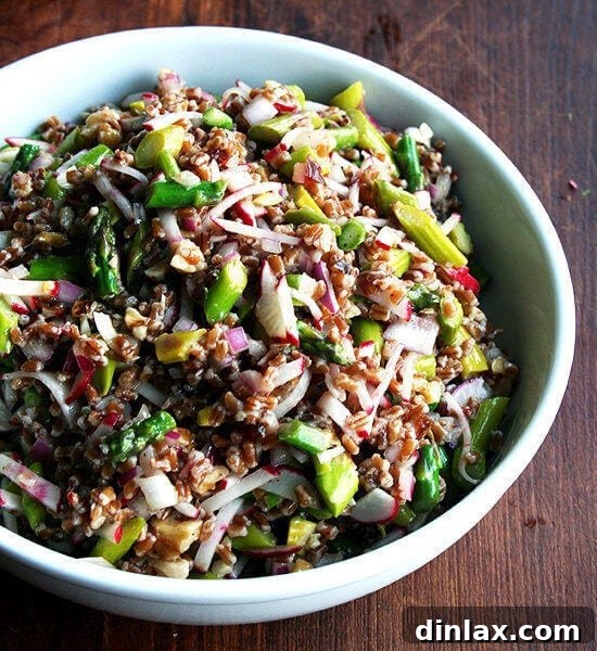 A bowl of spring wheat berry salad, garnished and ready to serve.