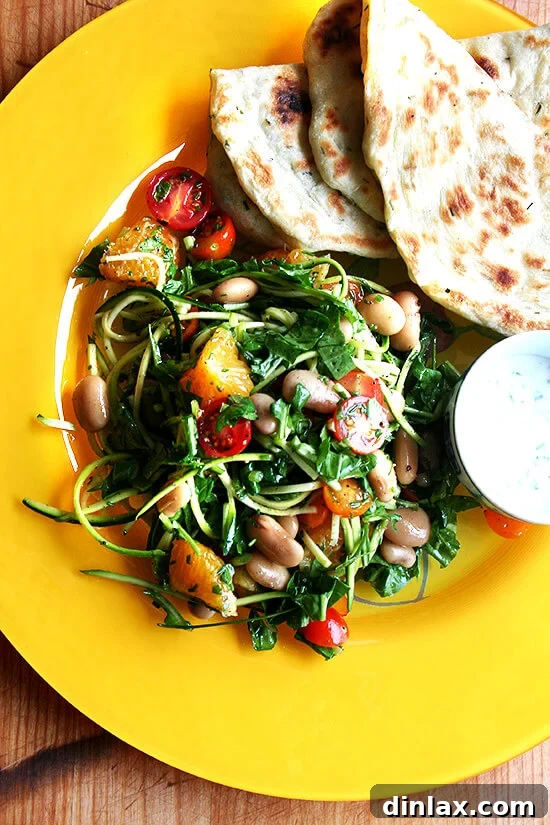 I have been wanting to incorporate more beans — such a healthy, affordable food, filled with protein — into my diet, and this salad has proven to be a great way to do so. I made this salad two nights in a row last week with my Alubia Criollo beans and other goodies from my CSA — arugula, cherry tomatoes, chives, shaved zucchini and chopped orange. // alexandracooks.com