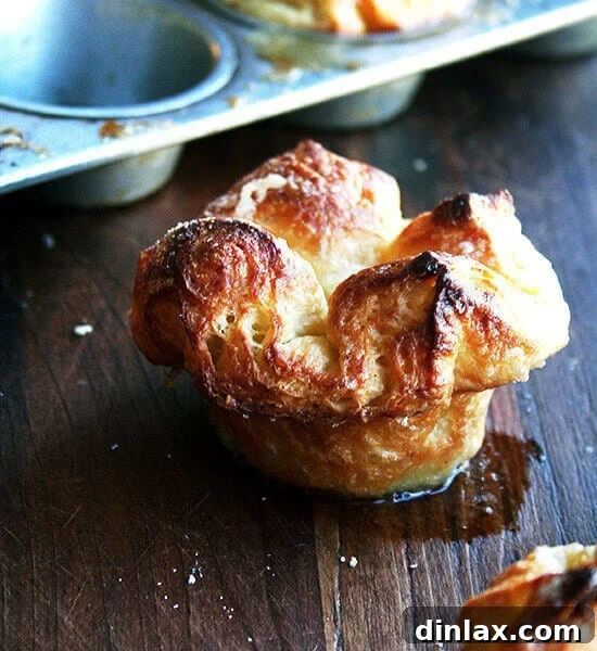 Kouign-Amann pastries cooling on a rack.
