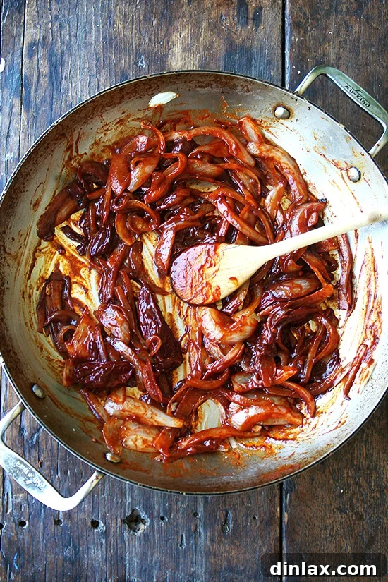 Spicy Smoky Chicken Tinga Tacos 5 Sautéed onions combined with smoky chipotles in adobo sauce in a large skillet.