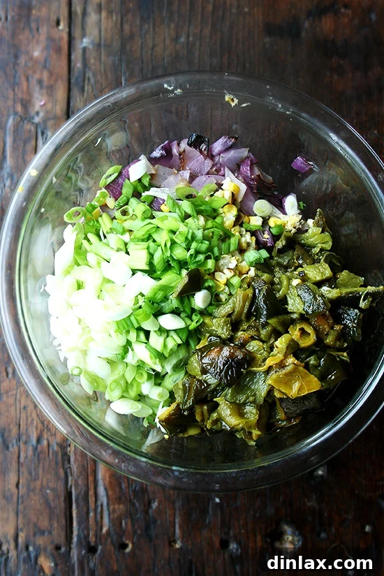 Smoky Grilled Poblano and Corn Salsa Tacos 5 Chopped grilled red onions, corn kernels, and scallions in a mixing bowl, seasoned and ready to be combined with the peeled poblanos.