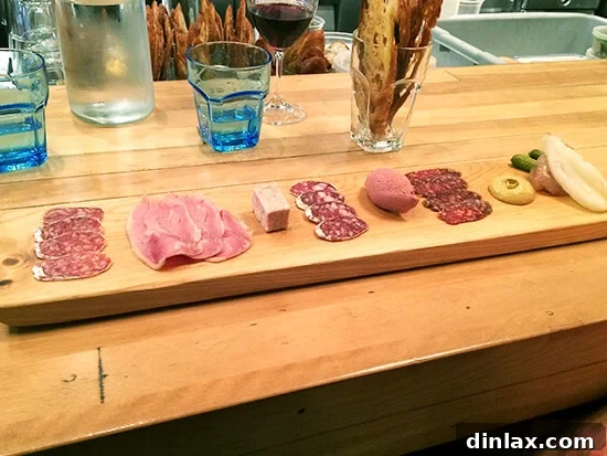 Charcuterie plate featuring pig liver mousse at Le Comptoir restaurant.