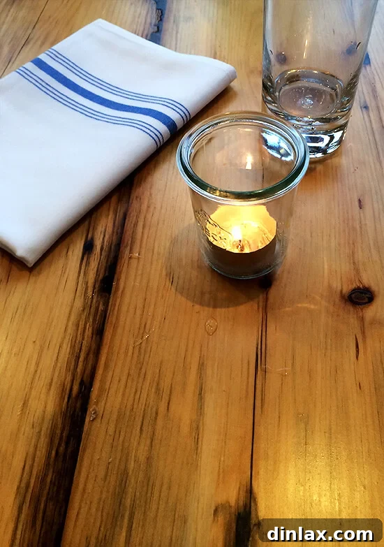 Decorative Weck jar votives creating ambient lighting at Sel Gras.