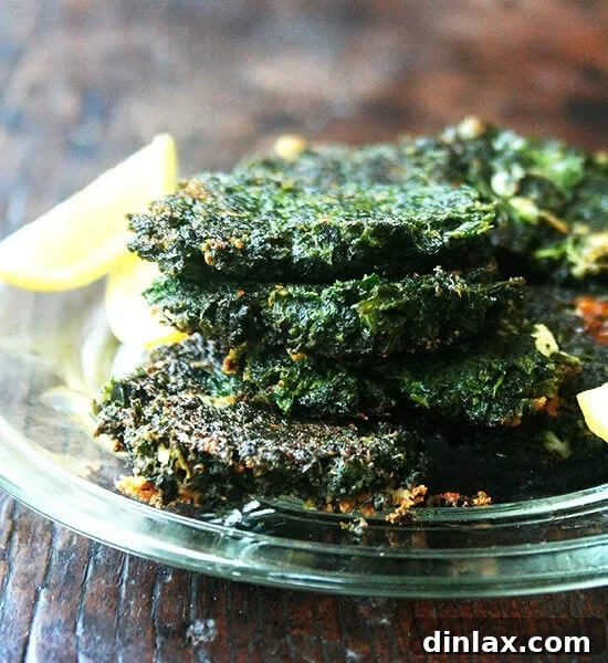 Crispy Swiss chard fritters with lemon, served on a plate.