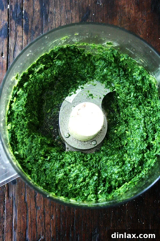 Smooth, puréed green fritter batter, vibrant and ready for feta cheese.