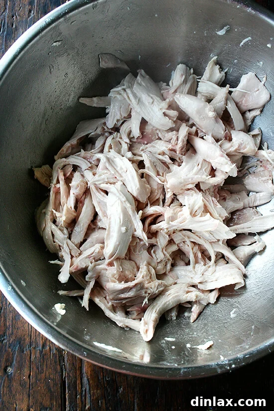 Perfectly cooked, shredded chicken ready for the salad base.
