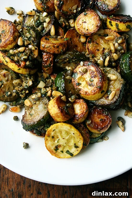 Bright Zucchini Sauté with Mint, Basil and Pine Nuts 7 A close-up shot of the sautéed zucchini with mint, basil, and pine nuts, highlighting the delicate herbs and browned squash.