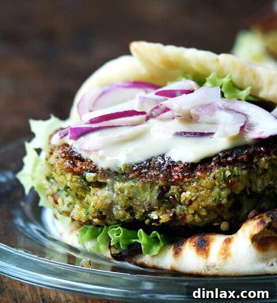 Beautifully cooked Chickpea & Quinoa Veggie Burger with accompaniments