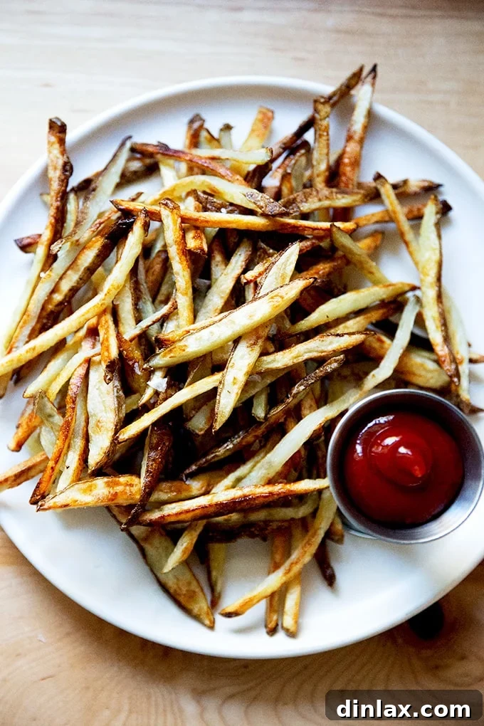 Golden Crispy Oven Fries 10 A large, tempting pile of homemade oven fries.