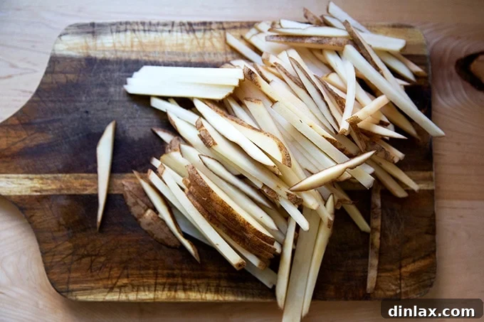 Golden Crispy Oven Fries 5 Close-up of potato sticks, showing ideal 1/4-inch thickness.