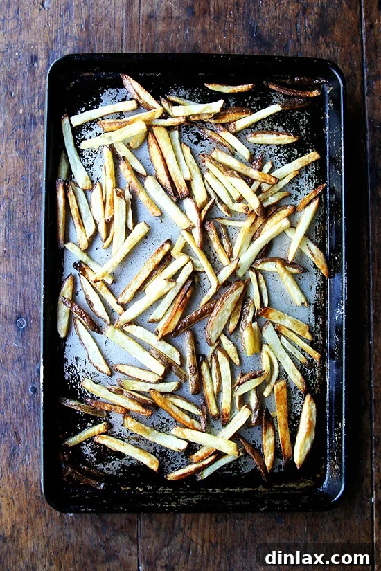 Golden Crispy Oven Fries 9 A sheet pan of perfectly baked homemade French fries.