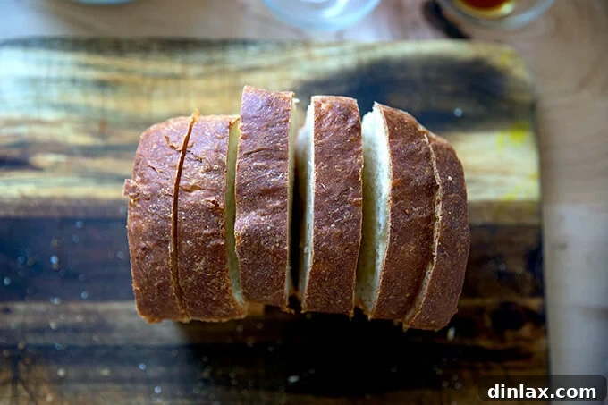 Six slices of brioche on a cutting board.
