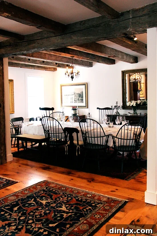 A beautifully set dining room table in a Vermont farmhouse, awaiting guests for a meal.