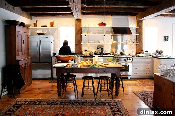 A rustic and inviting farmhouse kitchen in Vermont, showing charming details and natural light.