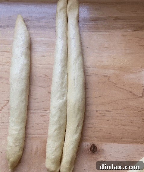 Freshly baked golden Challah bread, perfect for any meal.