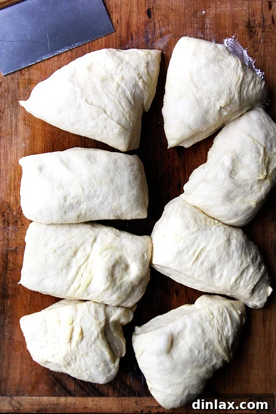 Dividing the Challah bread dough into even portions for braiding.