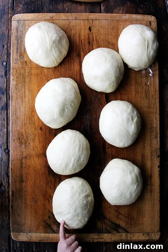 Uniformly balled portions of Challah bread dough, prepared for rolling into ropes.
