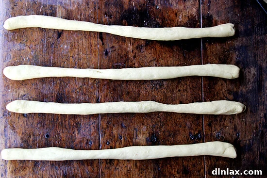 Step 1: Preparing Challah bread dough ropes for shaping.