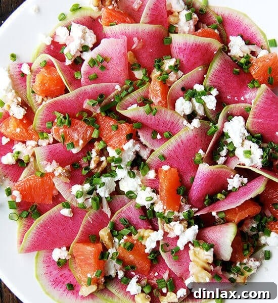 Watermelon radish salad with goat cheese, oranges, and walnuts.